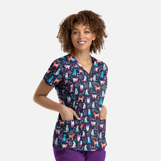A women's V-neck top featuring a playful print of various cats and dogs on a dark background, with pockets.