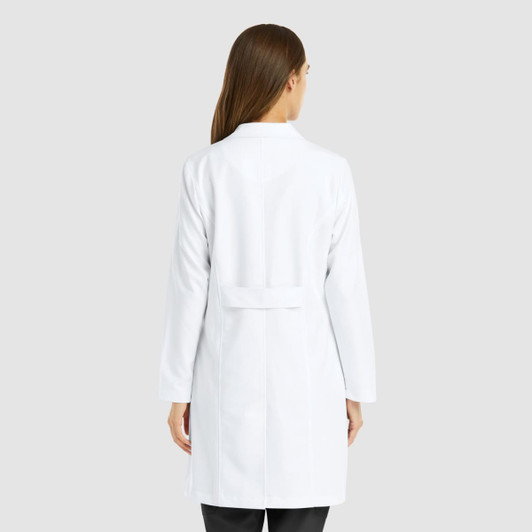 A white women's full-length lab coat with a back belt detail and long sleeves. It features a logo.