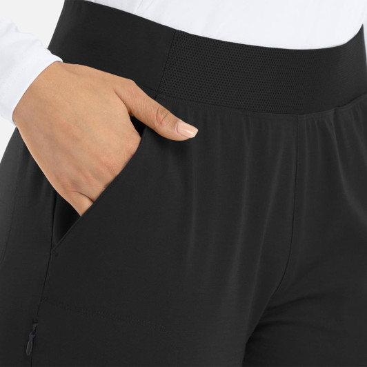 A woman's mid-rise jogger in black, featuring an elastic waistband and pockets.