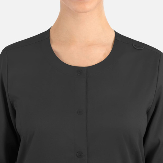 A women's round neck jacket in dark grey with a snap closure and a logo on the fabric.