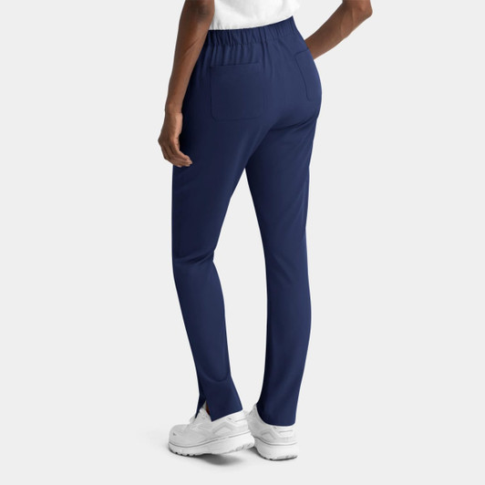 Navy women's skinny pull-on pants with a fitted design and elastic waistband, featuring pockets and side slits.