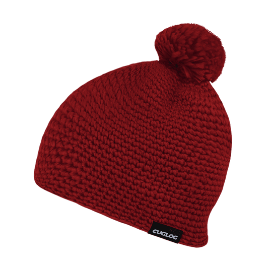 A red knitted beanie with a pom-pom on top and a logo tag on the side.