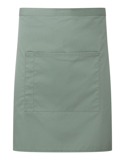 A mid-length pocket apron in a soft green shade, featuring a central pocket and branding.