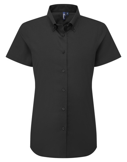 A short-sleeved women's Oxford shirt in black, featuring a button-up design and a collar. It has a logo on the chest.