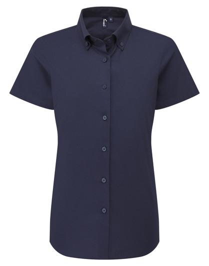 A short-sleeved women's shirt in navy blue with a collared neckline and buttons down the front. It has a logo.