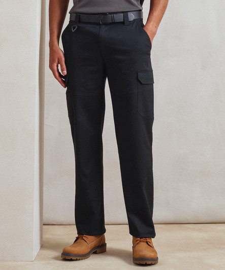 Black cargo trousers featuring multiple pockets, worn with a grey top and brown footwear. The trousers have a logo detail.
