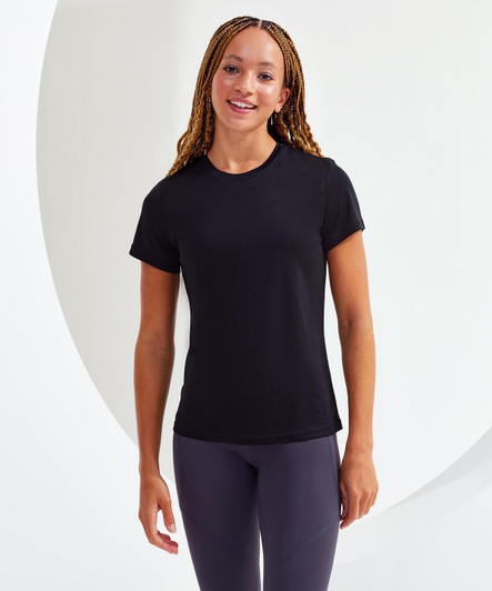 A black performance t-shirt displayed on a model with braided hair, featuring a round neckline and short sleeves.