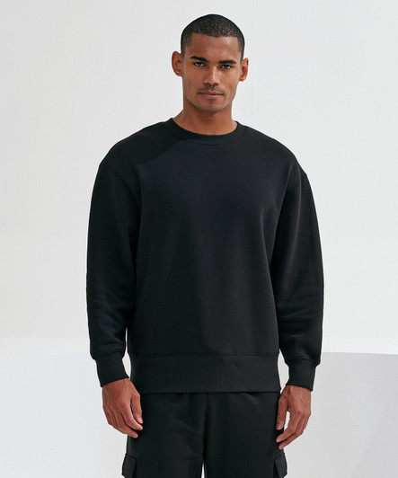 A unisex sweatshirt in black, featuring a relaxed fit and a simple design. It has a logo on the sleeve.