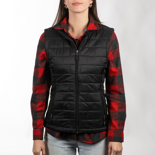 A black quilted puffer vest is worn over a red and black checkered shirt, featuring a zip front and pockets.