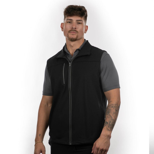 A black vest designed for active wear, featuring a zip front and a sleek design. A model is wearing the vest.