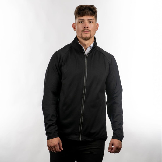 A man wearing a black full zip jacket, standing against a light background. The jacket features a logo.