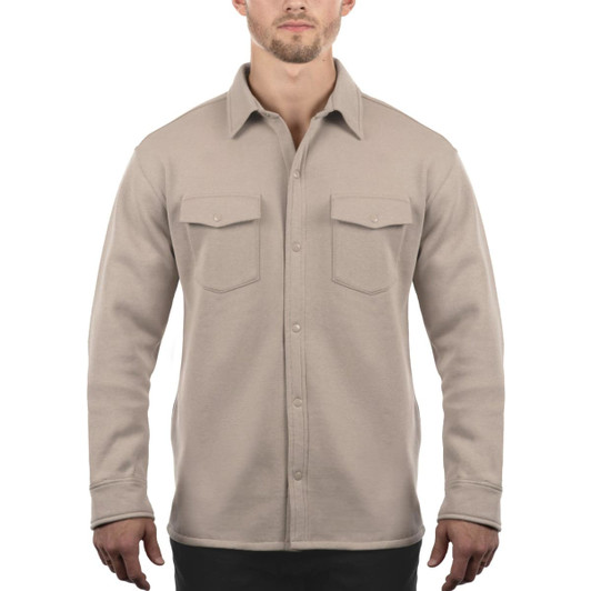 A light beige fleece snap jacket featuring a button-up front and two chest pockets. It has a logo on the sleeve.