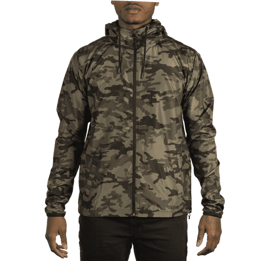 A lightweight windbreaker in a camouflage pattern, featuring a hood and zippered front. The jacket is shown on a model.