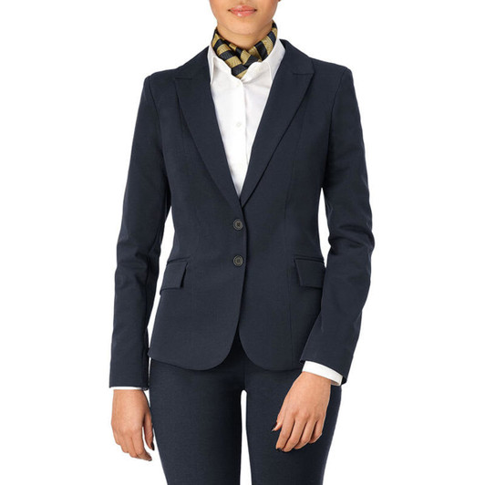 A woman models a navy Zaira jacket paired with a white shirt and a patterned scarf, showcasing a sleek, tailored fit.
