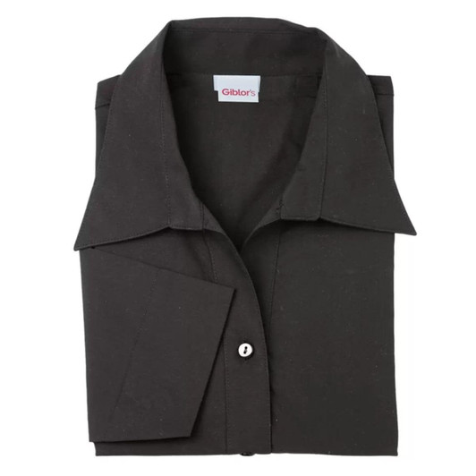 A folded black shirt with a collar, featuring a single button and a logo label on the inside.