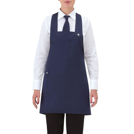 A navy blue apron with a pocket, worn over a white shirt and black trousers, featuring a logo on the apron.