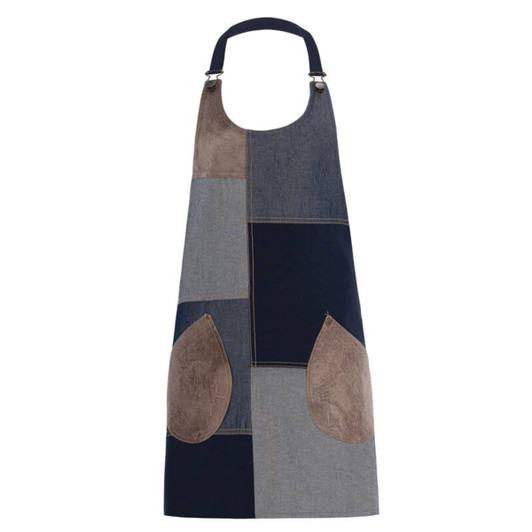 A patchwork apron featuring shades of blue and brown, with two large pockets and a logo.