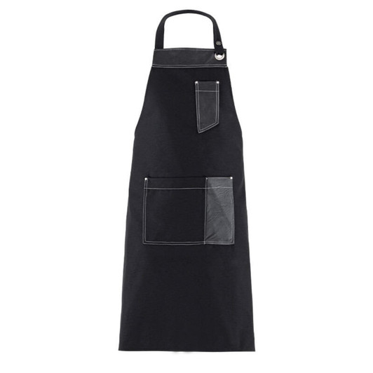 A black apron with contrasting white stitching and two front pockets. The design includes a neck strap and a branding logo.