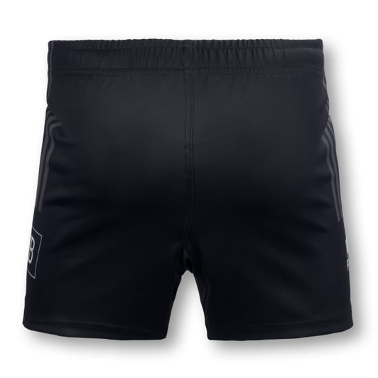 A pair of black men's rugby shorts featuring an elastic waistband and side stripes, with a logo on the lower leg.