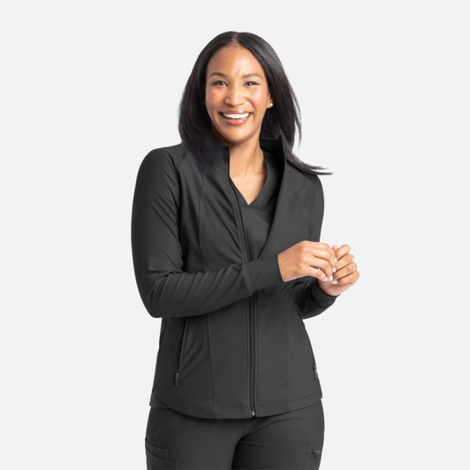 A full zip track jacket in black, featuring a fitted design and a zippered front, worn by a smiling woman.