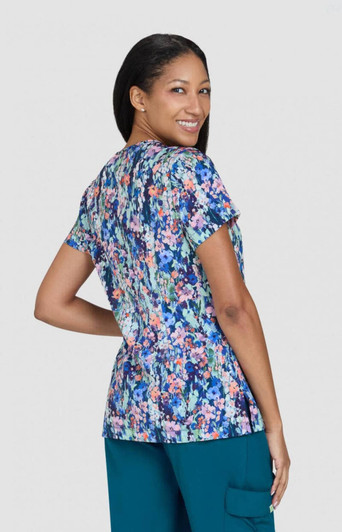 A floral print top with a variety of colours, featuring short sleeves and a relaxed fit. It has a logo.