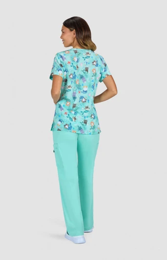 A patterned top featuring a variety of colours in turquoise, paired with matching aqua trousers.