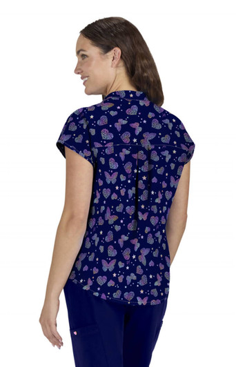 Ari Top (Print) in navy featuring a whimsical butterfly and heart pattern, displaying a woman from the back.
