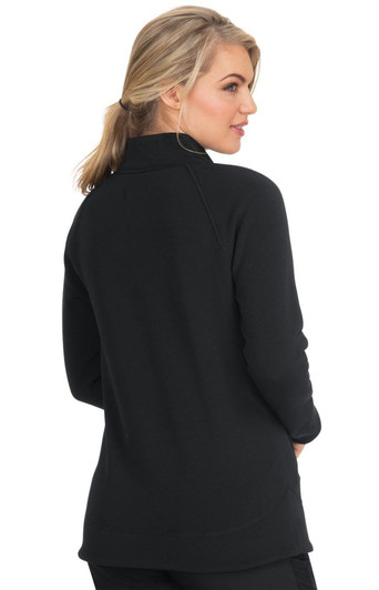 A woman wearing a black wellness jacket, viewed from the back, featuring a high collar and long sleeves.