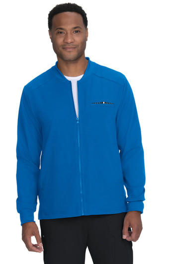 A blue jacket with a zip and a logo, worn by a man standing against a plain background.