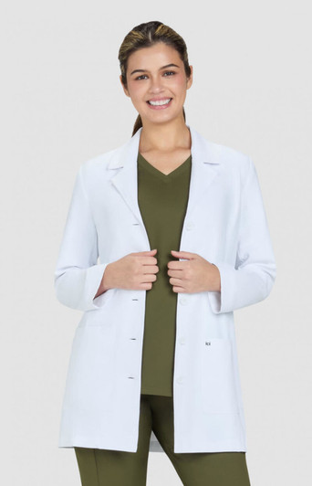 A white Hema lab coat is worn over a green top, featuring a fitted design and buttons at the front.