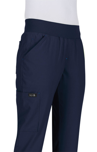 Navy blue pants with a comfortable waistband, featuring side pockets and a branding logo.