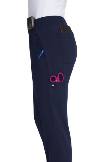 A pair of navy joggers featuring a logo, with pockets for a phone and pen.