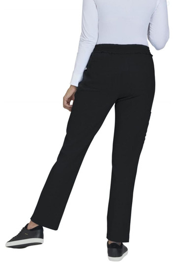 A pair of black pants from the back, featuring a straight leg design and worn with a light-coloured top and black shoes.
