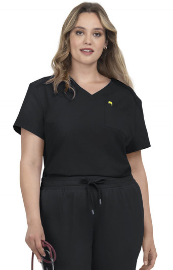 A woman wearing a black V-neck top with a pocket, featuring a subtle branding logo.
