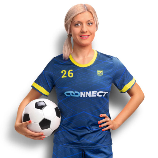 A woman in a blue and yellow custom soccer jersey holds a black and white soccer ball, featuring a logo.