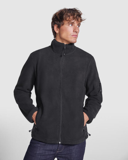 A black fleece jacket with a collar, featuring side pockets and a logo on the sleeve.