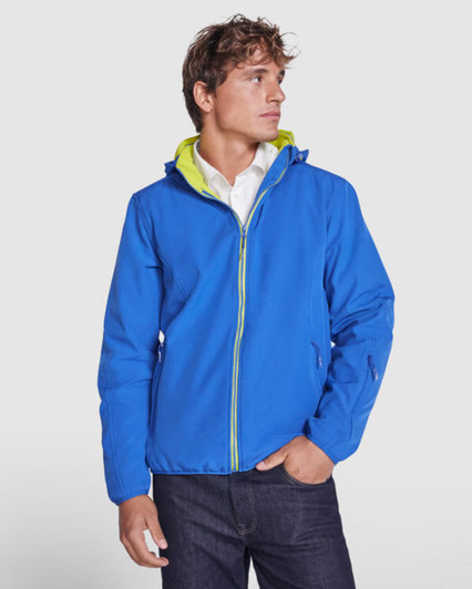 A blue unisex softshell jacket features a hood and a bright green interior, with a logo on the side.