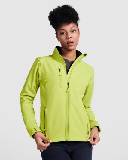 A bright lime green women's softshell jacket with a high collar and zipped pockets, featuring a logo.