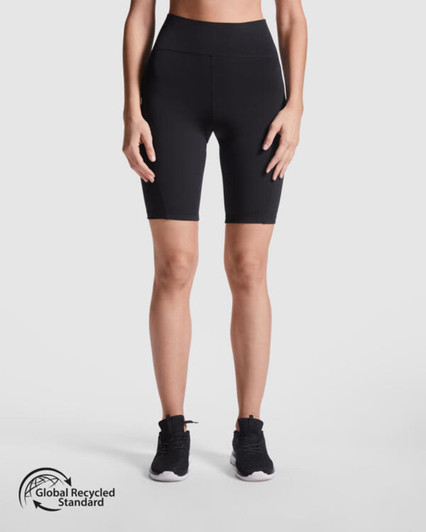 Black short leggings with a high waistband, shown on a model standing upright. Features a logo.