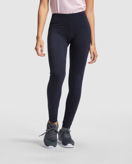 Navy leggings with a high waist, modelled by a person wearing a pink top and grey shoes. The image has a logo.