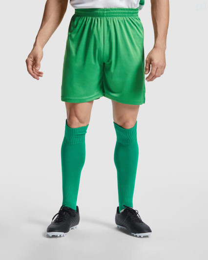 Green sports shorts paired with matching knee-length socks and black football boots, featuring a waistband for comfort.