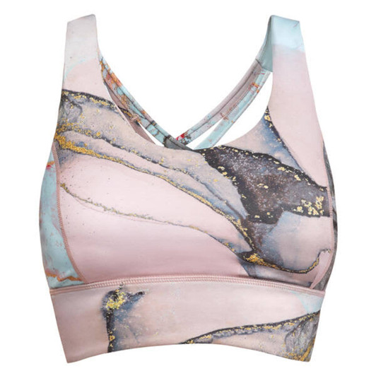 A cropped tank top in pastel pink with abstract blue and gold designs, featuring a cross-back style and a logo.
