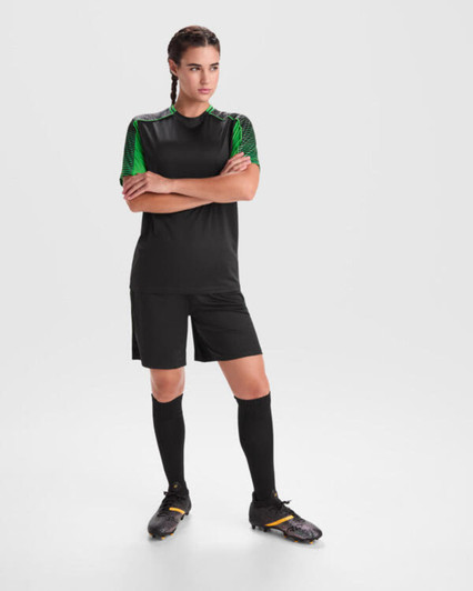 A black sports uniform featuring green accents, with a short-sleeved top, shorts, and knee-length socks.