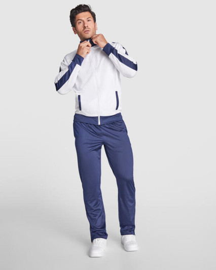 A tracksuit featuring a white jacket with navy accents and matching navy pants, accompanied by a branding logo.