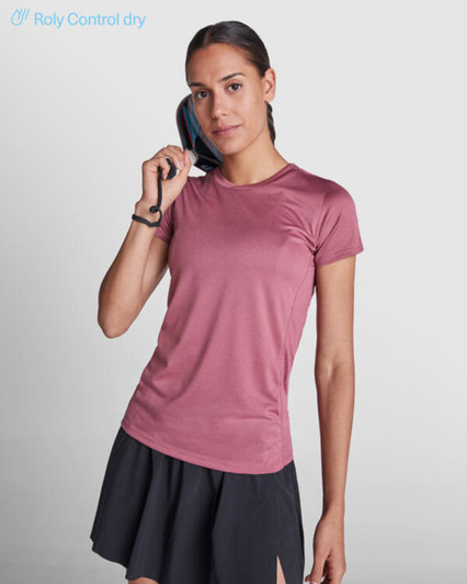 A pink women's T-shirt made from moisture-wicking fabric, paired with a black skirt, featuring a logo.