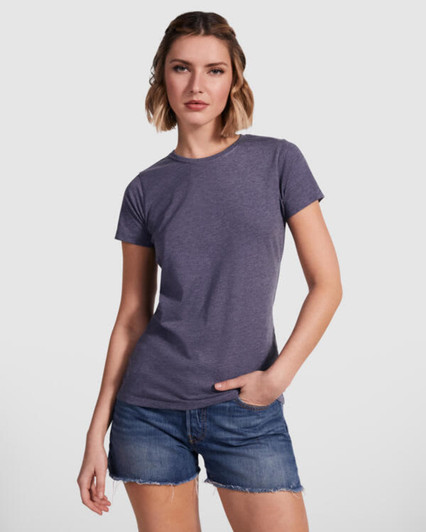 A women's t-shirt in a purple hue, paired with denim shorts. The shirt features a classic fit and a branding logo.