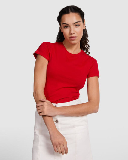 A red women's t-shirt with short sleeves, paired with a white skirt, displayed on a model.