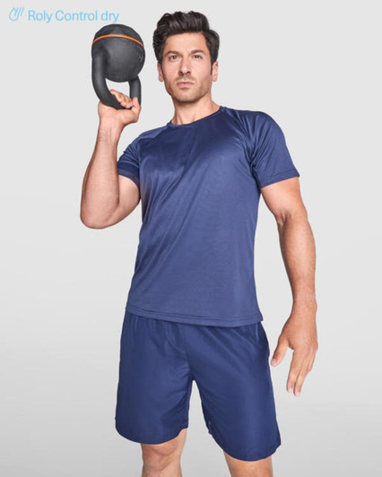 A man in a navy blue T-shirt and shorts holding a kettlebell, showcasing activewear for fitness.