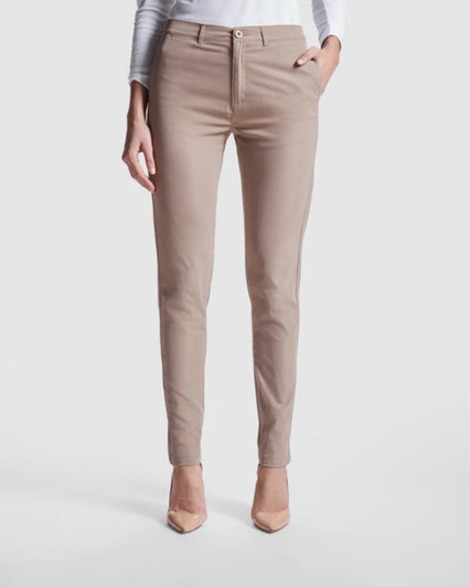 Beige women's chino trousers featuring a fitted design and front pockets, paired with a sleek top.