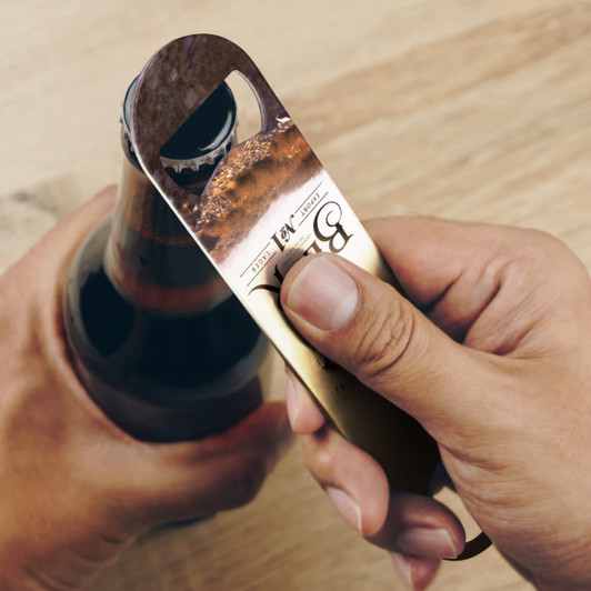 A drink bottle opener in gold and black, featuring a sleek design with a bottle being opened. It has a logo.